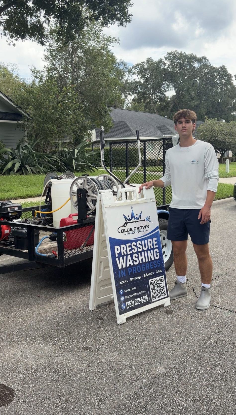 Evan Ferrell, owner of Blue Crown Pressure Washing LLC, with his pressure washing equipment trailer in Gainesville